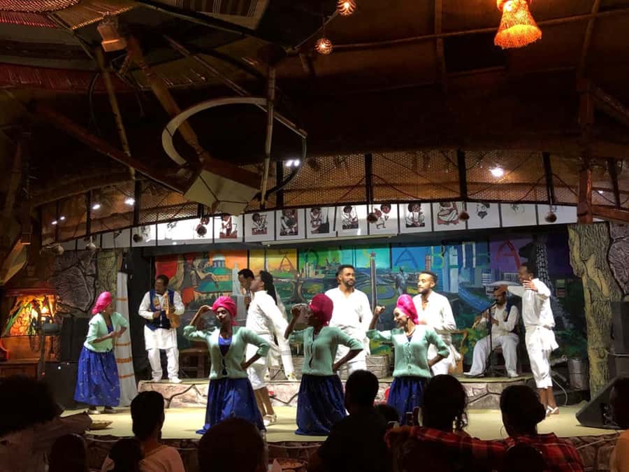 Yod Abyssinia Cultural Night: Dinner, Music, and Dance - Sitting down to injera, doro wat, and tibs